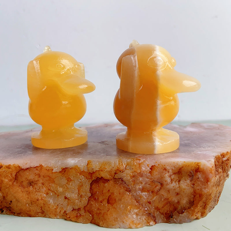 Orange Calcite Psyduck Carvings