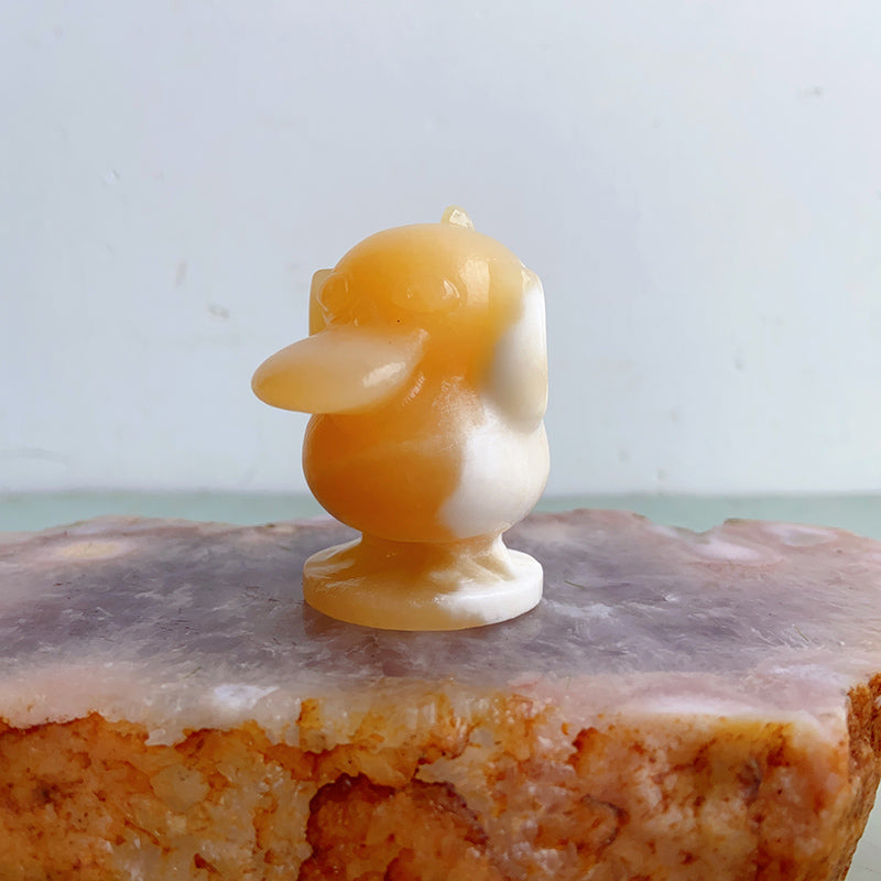 Orange Calcite Psyduck Carvings