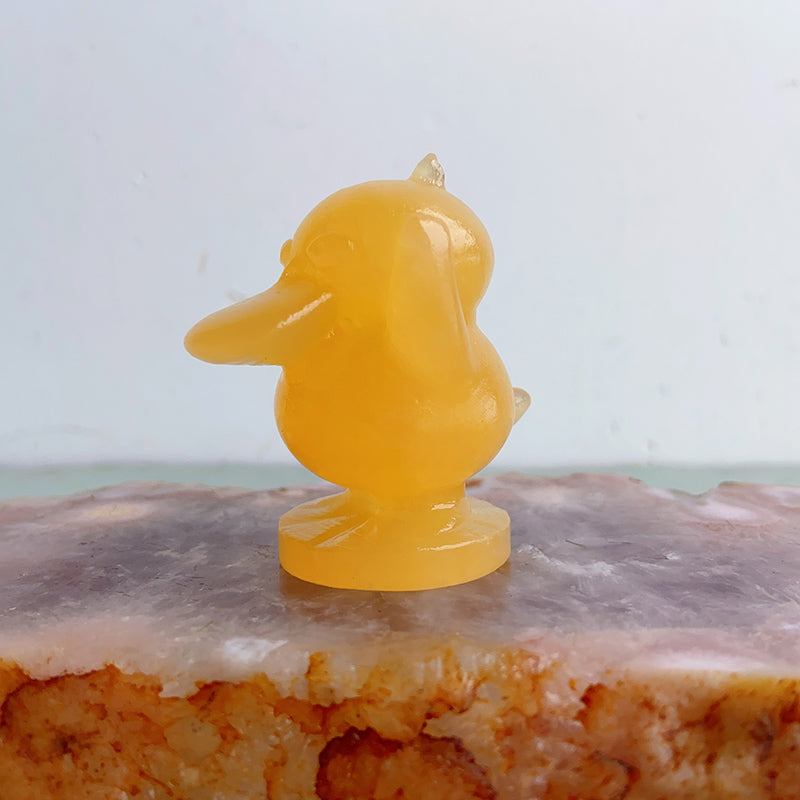 Orange Calcite Psyduck Carvings